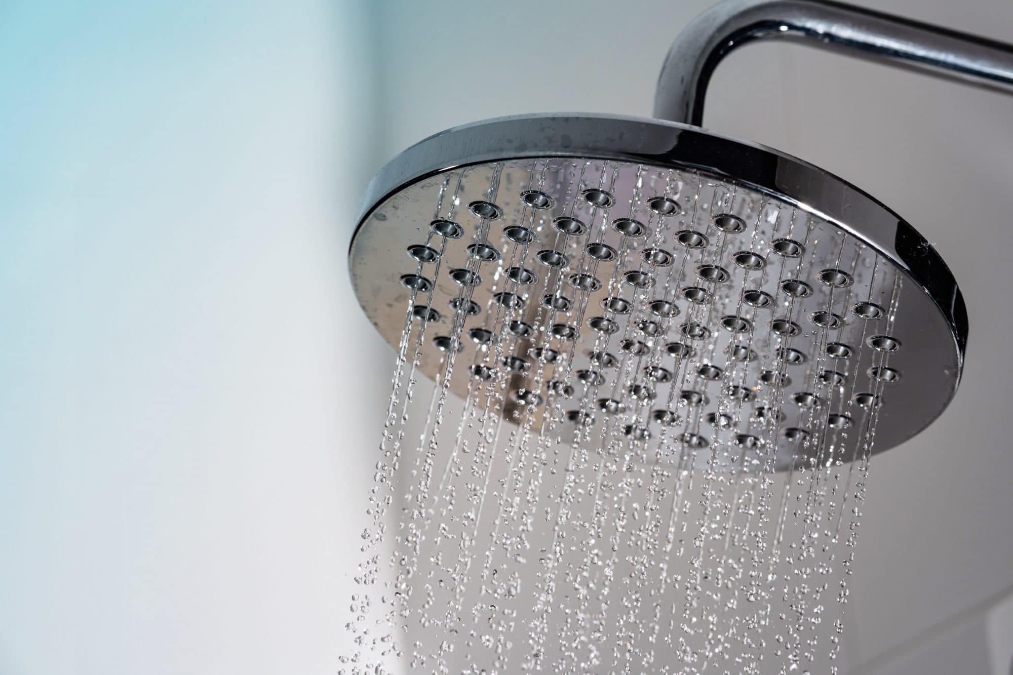 Close up of Water flowing from shower in the bathroom